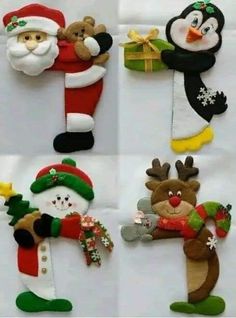 four different christmas ornaments with santa claus, penguin, snowman and reindeer on them