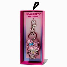 a hello kitty keychain with pink and blue crystals in it's box