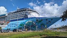 a large cruise ship docked at the dock