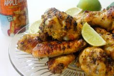 chicken wings with limes and a can of apple cider