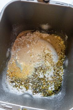 a metal pan filled with food on top of a table