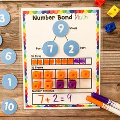 a number bond math game with legos on the table and numbers laid out next to it