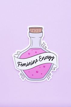 a sticker with the words feminine energy on it and a bottle filled with liquid