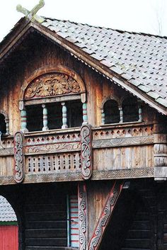 an old wooden building with ornate balcony and balconies