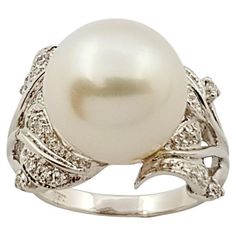 Pearl with Diamond 0.25 carat Ring set in 18 Karat White Gold Settings Width: 2.0 cm Length: 1.4 cm Ring Size: 55 Total Weight: 7.93 grams Pearl: 12.2 mm "We first opened doors in 1980 when it was then situated in the vicinity of the Victory Monument; a small and modest storefront with a couple of counters. From its humble beginnings to where it stands today, our company has proven its abilities as a jeweler. Since the beginning, we have been supplying fine quality pieces to dealers, wholesalers Luxury Pearl Ring With Single Cut Diamonds For Anniversary, Luxury White Pearl Ring With Halo, Luxury Pearl Ring With Halo Design, Luxury Diamond Pearl Ring With Halo Setting, Luxury Pearl Ring With Halo Setting For Anniversary, Luxury Akoya Pearl Anniversary Rings, Elegant White Signet Ring For Formal Occasions, White Pearl Ring With 17 Jewels For Formal Occasions, White Diamond Dome Ring For Formal Occasions