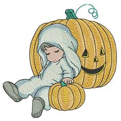 a baby in a pumpkin costume laying on the ground with a jack - o'- lantern