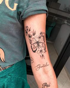 a person with a butterfly tattoo on their arm