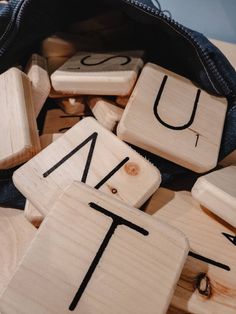 wooden letters and numbers are placed on top of each other