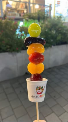 an ice cream cone with gummy bears in it