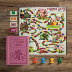 the candy land board game is next to its contents