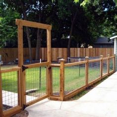 a fenced in yard with a wooden gate