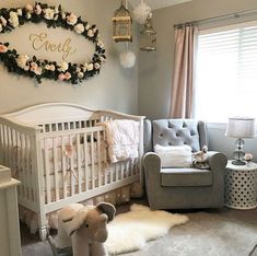 a baby's room with a crib, chair and teddy bear