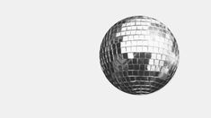 a shiny disco ball on a white background