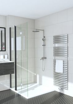 a bathroom with a shower, sink and towel rack on the wall next to the bathtub