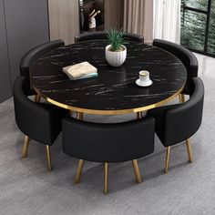 a round table with black chairs around it