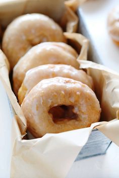 a box filled with donuts covered in frosting