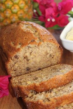 sliced loaf of banana bread sitting on top of a wooden table