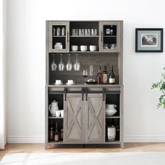 a wooden cabinet filled with bottles and glasses