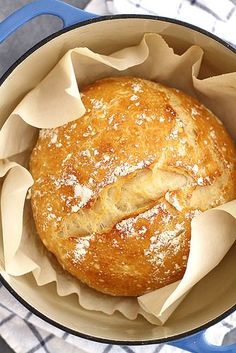 a loaf of bread in a blue pot