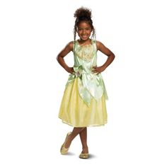 Disney Princess Dress up your kids in your favorite style and be ready to freeze everyone's attention when you walk into the party with this kids costume. Make them look super cute when they wear this classic costume. Tiana classic girl child Halloween costume Features one piece dress with shoulder straps Greenish top and skirt is yellow Costume goes below the knees Comes with bow on the waist with character cameo in center. Color: Green. Princess Tiana Costume, Princess Tiana Dress, Tiana Costume, Tiana Dress, Toddler Costumes Girl, Lay Lay, Disney Princess Costumes, Disney Princess Tiana, Classic Halloween Costumes