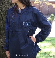 A lightweight monogrammed rain jacket is perfect for those rainy, windy days. This pullover jacket is lightweight and packable so you can tuck it in your bag and be prepared!• Lightweight packable hooded pullover with quarter-zip front. Wind and water resistant.• 100% nylon• Drawstring hood and Front welt pockets• Center-zip pocket• Hem casing with drawcordMeasurements (please check carefully):Small: Length 28"/Width 23.5"/Sleeve Length 35.5"Medium: Length 28.75"/Width 24.5"/Sleeve Length 35"Lar Monogrammed Rain Jacket, Windbreaker Women, Pi Beta Phi, Womens Windbreaker, Take Two, Be Prepared, Pullover Jacket, Hooded Pullover, Lightweight Jacket