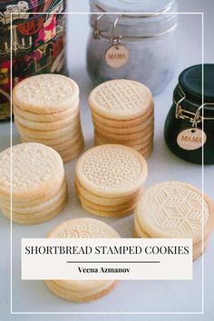 some cookies are stacked on top of each other with the words stamped cookies above them