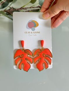 These earrings are designed to make a statement, whether you're strolling through city streets or lounging poolside at a tropical resort. Their eye-catching color and playful motif add a touch of whimsy to any outfit, instantly elevating your look with a burst of personality and flair. Add a pop of color and a touch of tropical charm to your wardrobe with these bold and beautiful earrings that are sure to become a favorite in your jewelry collection. Big Dangle Earrings, Tropical Earrings, Tropical Resort, Earrings Big, Earrings Summer, Orange Earrings, Summer Earrings, Tropical Theme, Summer Earring