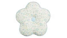 a blue and white flower shaped pillow