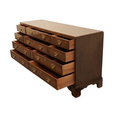 a wooden dresser with five drawers on it