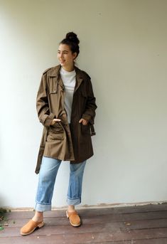 "Vintage trench coat in brown khaki military-style, short length, original belt attach, pockets, buttons down the front- upper button is missing, original tag intact, fully lined in gold satin. aside from minor signs of wear, very good vintage condition clean ready to wear. The model is 5'8\" and size S/M for reference. Tag size: 48 Approximate size: O.S- please refer to the measurements M E A S U R E M E N T S -were taken with garments laying flat, please double where necessary. --------------- Khaki Cargo Style Outerwear For Work, Brown Military Style Outerwear For Spring, Belted Utility Jacket For Work, Retro Brown Utility Jacket With Pockets, Brown Retro Utility Jacket With Pockets, Brown Military Utility Jacket For Workwear, Retro Khaki Utility Jacket With Pockets, Khaki Belted Utility Outerwear, Vintage Brown Utility Jacket For Spring