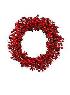 a wreath with red berries hanging from it's side on a white background,