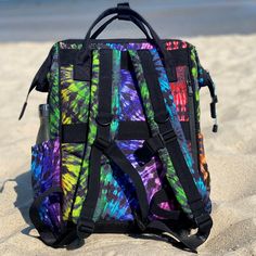 This bold and colorful rainbow tie-dye water bottle holder is perfect for staying hydrated at Pride or everyday. It's Pride everyday around here anyway! Our laptop backpack is everything you need for work, school, travel or adventure! Spacious, tons of organizational pockets and of course our unique and eye catching prints! -Measures approximately 16" tall x 11" wide x 8.5" deep -The laptop pocket measures 11" wide x 14.5" tall x 2" deep -Weighs 1lb 4oz. with a 21.4 liter / 32 lb capacity -Large Rainbow Tie, Water Bottle Holders, Tablet Sleeve, Quick Release Buckle, Blue Canvas, Laptop Pocket, Back Strap, Laptop Backpack, Wide Straps