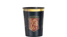 a harry potter tumbler with the hogwarts crest on it and gold rim