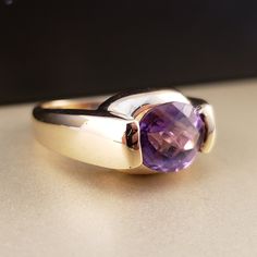 "\"Previously Loved, Not New\" Vintage Amethyst Ring, Featuring a Genuine Amethyst center (*Price of the ring is really gold only. The center is pretty scratched on the surface.*) This Genuine Purple Amethyst center stone is a checkered board cut oval shape. 14k Yellow Gold setting with 2 heavy bars. **Ring size: 6.25 **Amethyst is February's Birthstone, AND 2018 color of the year. This item can be sized up or down 2 sizes for an additional $30.00 Please feel free to contact me anytime, if you h Classic Solitaire Gemstones For Formal Occasions, Purple Ruby Ring For Formal Occasions, Luxury Purple Sapphire Ring For Formal Occasions, 14k Gold Polished Amethyst Ring, 14k Gold Amethyst Ring With Polished Finish, 14k Gold Round Amethyst Ring With Polished Finish, Timeless Purple Rings For Formal Occasions, Luxury Purple Rings For Anniversary, Luxury Purple Anniversary Rings