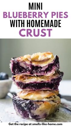 three blueberry pies stacked on top of each other with text overlay reading mini blueberry pies with homemade crust