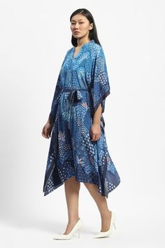 Blue navy asymmetric hem kaftan with al over miniature floral prints. Comes along with a belt. - Aza Fashions Blue Printed Kaftan For Summer, Blue Kaftan With Printed Motifs For Summer, Blue Festive Kaftan For Vacation, Blue Dress With Kimono Sleeves For Daywear, Blue Dresses With Kimono Sleeves For Daywear, Blue Summer Kaftan With Printed Motifs, Bohemian Blue Kaftan With Printed Motifs, Blue Kimono Sleeve Dress For Daywear, Bohemian Blue Printed Kaftan