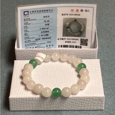 Certified Genuine 100% Natural Grade A White And Green China Tianshan Jadeite Jade Hand-Carved Authentic Beaded Gemstone Bangle Bracelet. Absolutely Gorgeous Rare Unique Beautifully Designed Bracelet! Certified Tested Genuine 100% Natural White Green Tianshan Jadeite Jade 10mm Gemstone Beads. *Also Comes In Nice Gift Box With Certificate Of Authenticity As Shown!* Same Day Shipping! White Jade Spiritual Bracelets, White Spiritual Jade Bracelets, Spiritual White Jade Bracelets, White Adjustable Jade Bracelets, White Jade Beaded Jewelry, White Beaded Jade Jewelry, Hand-strung White Jade Beaded Bracelets, White Jade Jewelry With 8mm Beads, Adjustable White Jade Beaded Bracelets