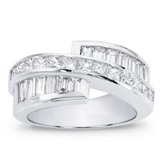 This channel set diamond band is set with 14 baguettes and 13 princess cut diamonds totaling 2.80cttw and is available in 14k, 18k, and platinum. Wedding Rings And Bands, Channel Set Diamond Band, Rings And Bands, Gorgeous Wedding Rings, Wedding Rings Princess Cut, Channel Set, Diamond Band, Princess Cut Diamonds, Pretty Jewellery