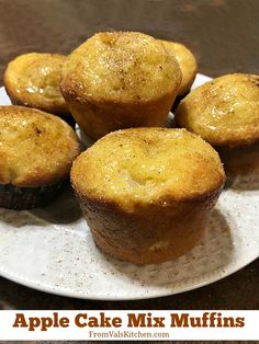 several muffins on a plate with the words apple cake mix muffins