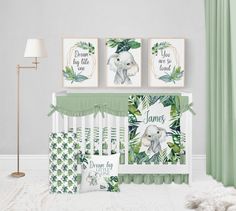 a baby's room with green and white decor, including an elephant crib