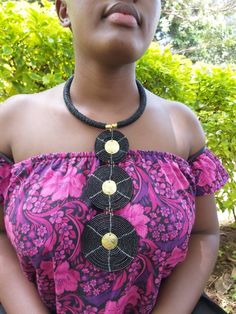 This is a fully handmade black African necklace, it is made using black longlasting fine beads. This necklace is a great jewellery piece and will match with most outfits. It is also a perfect gift for friends and family. This necklace is also available in any other colour you would prefer, request for customization by texting us or just leave a note after placing your order saying your preferred color. The necklace is very easy to put on and remove and also it is light. We offer fast shipping wo Bohemian Jewelry With Black Beads, Round Shape, Bohemian Jewelry With Black Beads, Bohemian Jewelry With Black Round Beads, Polished Black Beads For Long Necklace, Black Polished Long Necklace Beads, Bohemian Black Beaded Jewelry, Traditional Black Beaded Necklaces For Festivals, Bohemian Black Choker For Jewelry Making, Traditional Black Beaded Necklace For Party