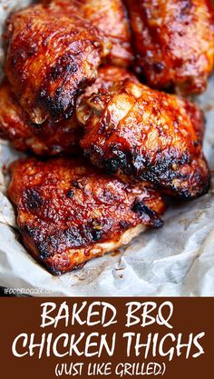 chicken wings covered in bbq sauce sitting on wax paper