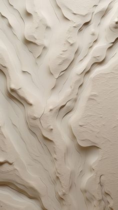 an abstract painting with white paint on the wall