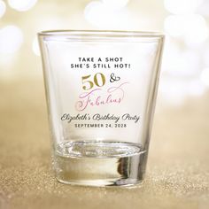 a shot glass with the words 50 and an anniversary party written on it