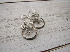 Sterling Silver Swirls Modern Twist Silver Jewelry With Ear Wire, Modern Twist Silver Spiral Earrings, Hammered Sterling Silver Spiral Jewelry, Hammered Spiral Sterling Silver Jewelry, Modern Twist Silver Hammered Jewelry, Handmade Silver Swirl Earrings, Sterling Silver Swirl Jewelry With Matching Earrings, Nickel Free Silver Swirl Earrings, Hand Forged Silver Swirl Jewelry