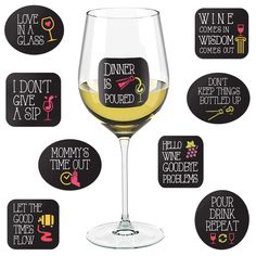 a wine glass filled with white wine surrounded by different types of stickers and magnets