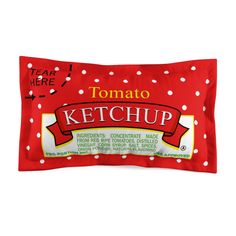 a red ketchup bar with white polka dots on the front and bottom half