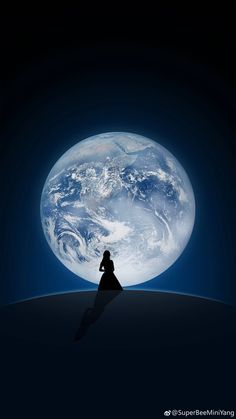 a person sitting on top of a hill in front of the moon with earth in the background