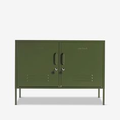 a green metal cabinet with two doors