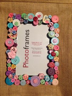 a photo frame made out of buttons